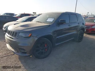 2015 Jeep Grand Cherokee SRT with VIN 1C4RJFDJ9FC842448, listed as a IAAI auction lot 41850385 with 178,439 mi miles. Bid and sale history available at carsss.com. Image 2.