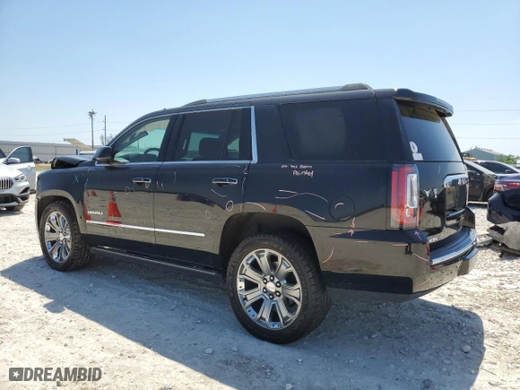 2015 GMC Yukon Denali with VIN 1GKS1CKJXFR523628, listed as a Copart auction lot 51730455 with 59,695 mi miles and Salvage Title. Bid and sale history available at carsss.com. Image 2.