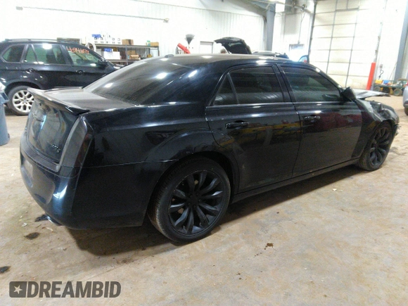 2014 Chrysler 300 S with VIN 2C3CCABG2EH343503, listed as a IAAI auction lot 40934463 with 128,876 mi miles and . Bid and sale history available at carsss.com. Image 4.