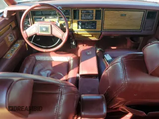 1984 Cadillac Seville z VIN 1G6AS6984EE826325, wystawiony jako Copart lot #77209864 z przebiegiem 26 366 mil mil oraz Tytuł czysty. Historia ofert i sprzedaży dostępna na DreamBid. Obrazek 8.