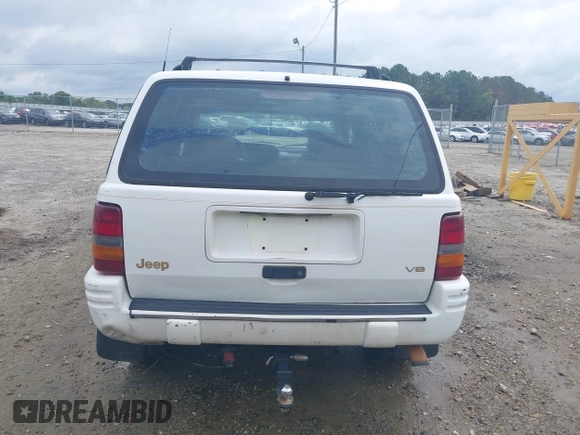 1996 Jeep Grand Cherokee Limited z VIN 1J4GZ78YXTC191527, wystawiony jako IAAI lot #42352616 z przebiegiem 325 927 mil mil oraz . Historia ofert i sprzedaży dostępna na DreamBid. Obrazek 17.