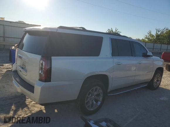 2015 GMC Yukon XL SLT with VIN 1GKS1HKC6FR166415, listed as a Copart auction lot 73029014 with 105,209 mi miles and Salvage Title. Bid and sale history available at carsss.com. Image 3.