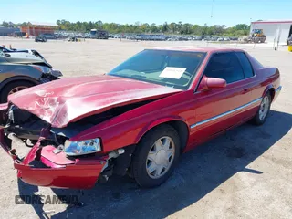 2002 Cadillac Eldorado ESC z VIN 1G6EL12Y72B102153, wystawiony jako IAAI lot #41861541 z przebiegiem 91 273 mil mil oraz . Historia ofert i sprzedaży dostępna na DreamBid. Obrazek 17.