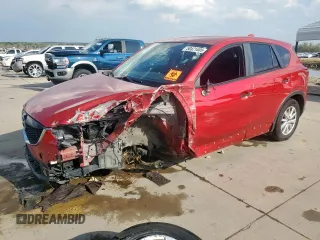 2014 Mazda CX-5 Touring with VIN JM3KE2CY1E0323298, listed as a Copart auction lot 50421685 with 214,739 mi miles and Salvage Title. Bid and sale history available at DreamBid. Image 1.