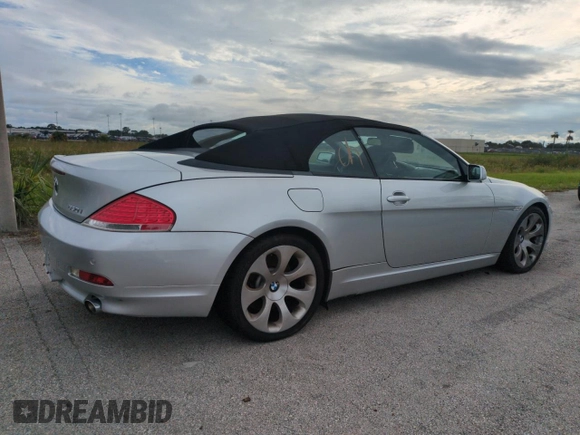 2006 BMW 6 Series 650Ci z VIN WBAEK13406CN72159, wystawiony jako Copart lot #75078214 z przebiegiem Nie podano mil oraz Szkoda całkowita • Salvage title. Historia ofert i sprzedaży dostępna na DreamBid. Obrazek 3.