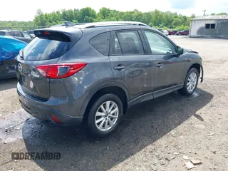 2015 Mazda CX-5 Touring with VIN JM3KE4CY9F0506879, listed as a IAAI auction lot 42209768 with 87,690 mi miles and . Bid and sale history available at DreamBid. Image 4.