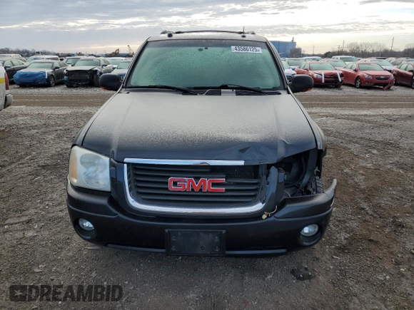 2005 GMC Envoy SLT with VIN 1GKDT13S552310799, listed as a Copart auction lot 43586125 with 182,928 mi miles and Salvage Title. Bid and sale history available at carsss.com. Image 5.