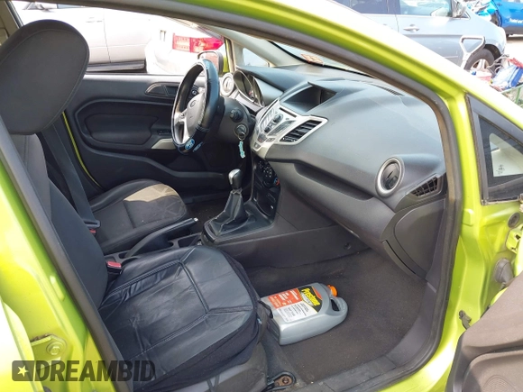 2011 Ford Fiesta SE z VIN 3FADP4BJ7BM122774, wystawiony jako IAAI lot #42392327 z przebiegiem 174 764 mil mil oraz . Historia ofert i sprzedaży dostępna na DreamBid. Obrazek 5.