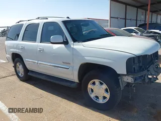 2005 GMC Yukon SLT z VIN 1GKEC13TX5R276234, wystawiony jako IAAI lot #42127846 z przebiegiem 210 802 mil mil oraz . Historia ofert i sprzedaży dostępna na DreamBid. Obrazek 14.