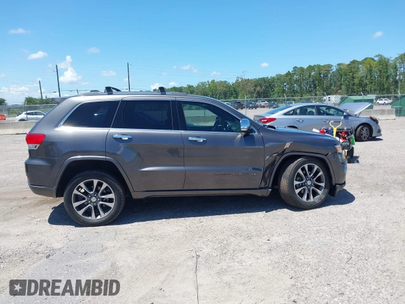 2017 Jeep Grand Cherokee Overland with VIN 1C4RJFCG2HC641791, listed as a IAAI auction lot 42566654 with 116,764 mi miles and . Bid and sale history available at DreamBid. Image 13.