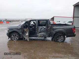 2019 Ford F-150 XL with VIN 1FTEW1C56KKC31025, listed as a IAAI auction lot 41452618 with 153,422 mi miles and . Bid and sale history available at DreamBid. Image 14.