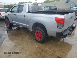 2010 Toyota Tundra with VIN 5TFUY5F15AX123633, listed as a Copart auction lot 57053995 with 85,716 mi miles and Salvage title. Bid and sale history available at DreamBid. Image 2.
