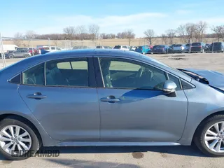 2023 Toyota Corolla Hybrid LE with VIN JTDBCMFEXPJ014034, listed as a IAAI auction lot 41865829 with 33,210 mi miles and . Bid and sale history available at carsss.com. Image 14.