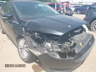 2015 Ford Focus Titanium with VIN 1FADP3J24FL385526, listed as a IAAI auction lot 42011712 with 162,696 mi miles and . Bid and sale history available at carsss.com. Image 12.