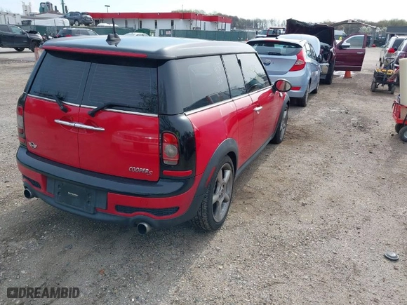 2009 MINI Cooper Clubman S with VIN WMWMM335X9TP74957, listed as a IAAI auction lot 41951315 with 142,387 mi miles. Bid and sale history available at carsss.com. Image 4.