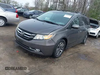 2014 Honda Odyssey Touring with VIN 5FNRL5H94EB020257, listed as a IAAI auction lot 41924245 with 204,526 mi miles and . Bid and sale history available at DreamBid. Image 2.