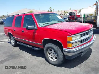 1999 Chevrolet Suburban z VIN 3GNFK16R4XG246028, wystawiony jako IAAI lot #42442860 z przebiegiem 172 722 mil mil oraz . Historia ofert i sprzedaży dostępna na DreamBid. Obrazek 1.