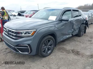 2022 Volkswagen Atlas SEL R-Line z VIN 1V2SE2CA2NC208363, wystawiony jako IAAI lot #41850237 z przebiegiem 38 867 mil mil oraz . Historia ofert i sprzedaży dostępna na DreamBid. Obrazek 2.