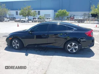 2020 Honda Civic LX with VIN 19XFC2F66LE213975, listed as a IAAI auction lot 42398098 with 69,902 mi miles and . Bid and sale history available at DreamBid. Image 14.