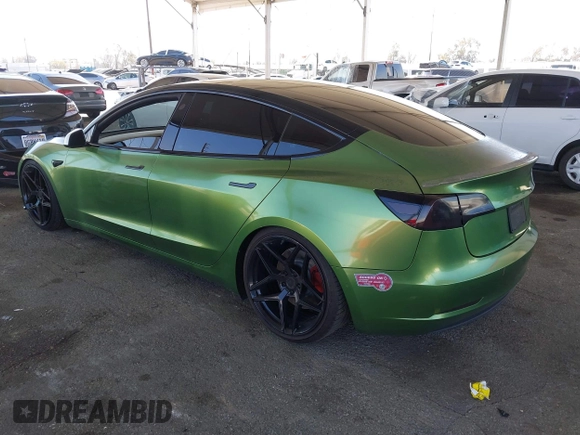 2020 Tesla Model 3 Standard Range Plus with VIN 5YJ3E1EA4LF799650, listed as a IAAI auction lot 41817538 with 54,835 mi miles. Bid and sale history available at carsss.com. Image 3.