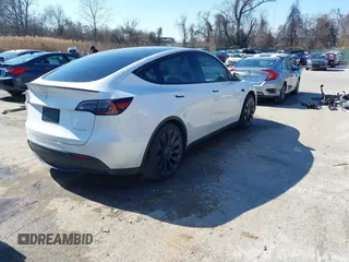 2021 Tesla Model Y Performance with VIN 5YJYGDEF8MF246658, listed as a IAAI auction lot 41679793 with 28,015 mi miles and . Bid and sale history available at DreamBid. Image 4.