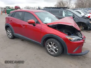 2016 Mazda CX-3 Touring z VIN JM1DKDC75G0127011, wystawiony jako IAAI lot #41298779 z przebiegiem 141 889 mil mil oraz . Historia ofert i sprzedaży dostępna na DreamBid. Obrazek 1.