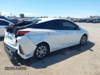 2021 Toyota Prius LE with VIN JTDKAMFP2M3184900, listed as a IAAI auction lot 42014569 with 81,563 mi miles and . Bid and sale history available at DreamBid. Image 4.