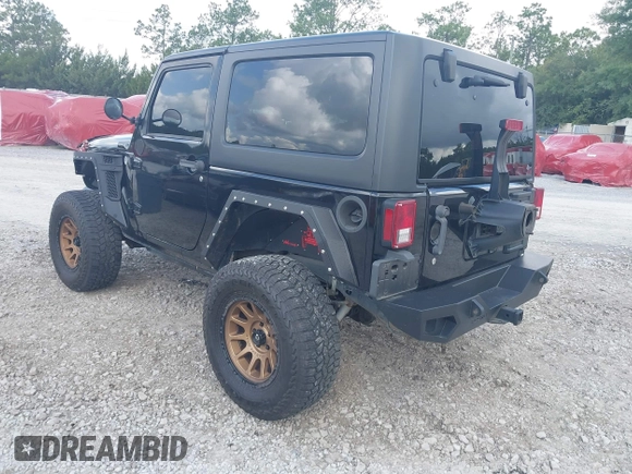 2012 Jeep Wrangler Sport z VIN 1C4AJWAG2CL286680, wystawiony jako IAAI lot #42434411 z przebiegiem 97 142 mil mil oraz . Historia ofert i sprzedaży dostępna na DreamBid. Obrazek 3.