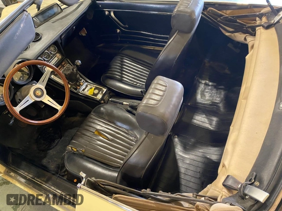 1973 Alfa Romeo Spider z VIN AR3041681, wystawiony jako Copart lot #51425165 z przebiegiem 20 513 mil mil oraz Tytuł czysty. Historia ofert i sprzedaży dostępna na DreamBid. Obrazek 9.