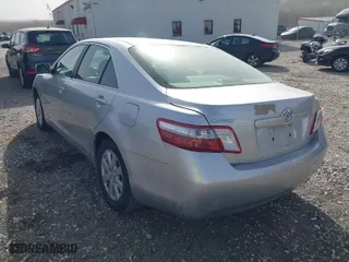 2007 Toyota Camry Hybrid with VIN JTNBB46K473000672, listed as a IAAI auction lot 41841447 with 216,474 mi miles. Bid and sale history available at carsss.com. Image 3.