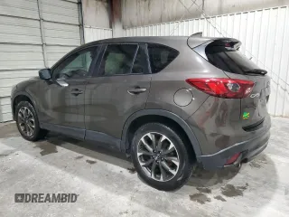 2016 Mazda CX-5 Grand Touring z VIN JM3KE2DY5G0821683, wystawiony jako Copart lot #51929905 z przebiegiem 119 392 mil mil oraz Czysty tytuł • Clean title. Historia ofert i sprzedaży dostępna na DreamBid. Obrazek 2.