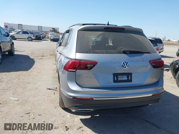 2021 Volkswagen Tiguan SE with VIN 3VV3B7AX0MM026064, listed as a IAAI auction lot 42038137 with 18,526 mi miles and . Bid and sale history available at DreamBid. Image 3.