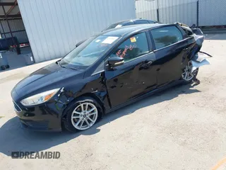 2016 Ford Focus SE z VIN 1FADP3F28GL213252, wystawiony jako IAAI lot #42660857 z przebiegiem 120 226 mil mil oraz . Historia ofert i sprzedaży dostępna na DreamBid. Obrazek 2.