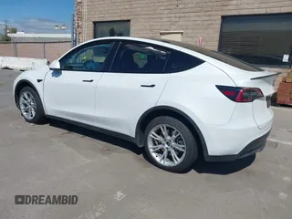 2023 Tesla Model Y Long Range with VIN 7SAYGDEE2PF696336, listed as a IAAI auction lot 41894686 with 34,203 mi miles. Bid and sale history available at carsss.com. Image 3.