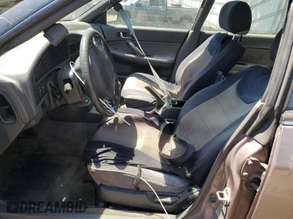 1993 Subaru Legacy L with VIN 4S3BJ6339P6948161, listed as a Copart auction lot 63123584 with 329,619 mi miles and Salvage Title. Bid and sale history available at DreamBid. Image 7.