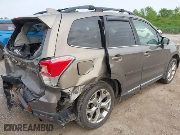 2017 Subaru Forester Touring z VIN JF2SJAWC6HH529707, wystawiony jako IAAI lot #42401138 z przebiegiem 172 868 mil mil oraz . Historia ofert i sprzedaży dostępna na DreamBid. Obrazek 4.