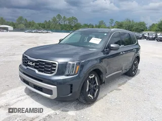 2023 Kia Telluride S with VIN 5XYP64GC0PG386895, listed as a IAAI auction lot 42365625 with 41,588 mi miles and . Bid and sale history available at DreamBid. Image 2.