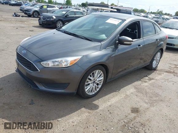 2018 Ford Focus SE z VIN 1FADP3F20JL327186, wystawiony jako IAAI lot #42271070 z przebiegiem 131 511 mil mil oraz . Historia ofert i sprzedaży dostępna na DreamBid. Obrazek 17.