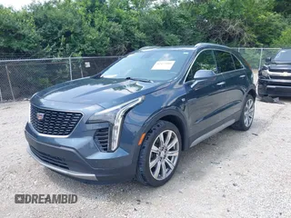 2019 Cadillac XT4 FWD Premium Luxury z VIN 1GYFZCR43KF143980, wystawiony jako IAAI lot #42472400 z przebiegiem 36 496 mil mil oraz . Historia ofert i sprzedaży dostępna na DreamBid. Obrazek 6.