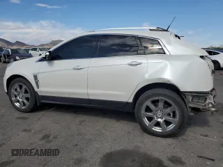 2012 Cadillac SRX Performance Collection with VIN 3GYFNBE33CS540914, listed as a Copart auction lot 54787125 with 130,357 mi miles and Salvage title. Bid and sale history available at DreamBid. Image 2.