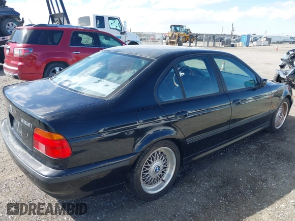 2000 BMW 5 Series 528iA with VIN WBADM6344YGU10257, listed as a IAAI auction lot 41773733 with 231,028 mi miles. Bid and sale history available at carsss.com. Image 4.