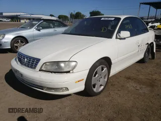 2001 Cadillac Catera z VIN W06VR54RX1R070430, wystawiony jako Copart lot #37051650 z przebiegiem 74 568 mil mil oraz Szkody całkowita. Historia ofert i sprzedaży dostępna na DreamBid. Obrazek 2.