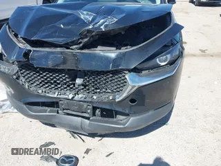 2022 Mazda CX-30 S Select z VIN 3MVDMBBL7NM413447, wystawiony jako IAAI lot #41772804 z przebiegiem 69 102 mil mil oraz . Historia ofert i sprzedaży dostępna na DreamBid. Obrazek 6.