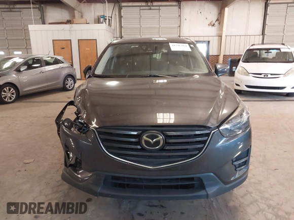2016 Mazda CX-5 Grand Touring with VIN JM3KE2DYXG0846787, listed as a IAAI auction lot 41346364 with 113,553 mi miles. Bid and sale history available at carsss.com. Image 12.