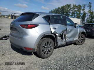 2018 Mazda CX-5 Grand Touring с VIN JM3KFBDM5J0323923, выставлен на аукционе Copart как лот 58162435 с пробегом 144 792 миль миль и Списание • Salvage title. История ставок и продаж доступна на DreamBid. Изображение 3.