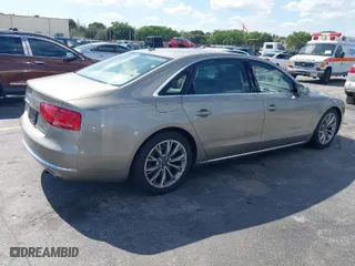 2012 Audi A8 L with VIN WAURVAFD0CN001646, listed as a IAAI auction lot 41524110 with 105,187 mi miles. Bid and sale history available at carsss.com. Image 4.