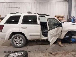 2010 Jeep Grand Cherokee Laredo with VIN 1J4PR4GK7AC126059, listed as a IAAI auction lot 41599058 with 154,192 mi miles. Bid and sale history available at carsss.com. Image 14.
