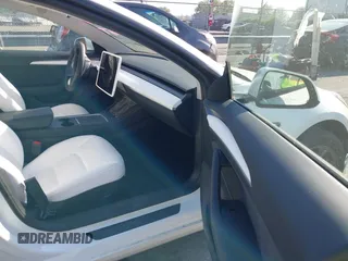 2023 Tesla Model 3 z VIN 5YJ3E1EA3PF600030, wystawiony jako IAAI lot #42052459 z przebiegiem 11 177 mil mil oraz . Historia ofert i sprzedaży dostępna na DreamBid. Obrazek 5.