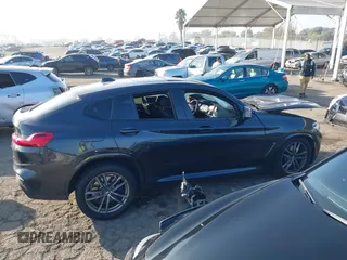 2019 BMW X4 M40i z VIN 5UXUJ5C54KLJ64077, wystawiony jako IAAI lot #41012233 z przebiegiem 40 737 mil mil oraz . Historia ofert i sprzedaży dostępna na DreamBid. Obrazek 12.