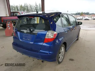 2009 Honda Fit Sport with VIN JHMGE88459C001743, listed as a IAAI auction lot 41852048 with 128,225 mi miles. Bid and sale history available at carsss.com. Image 4.